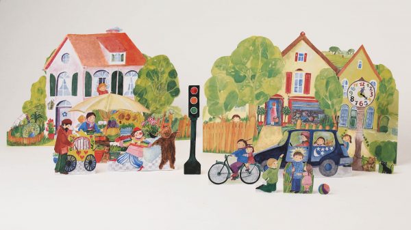 Die ausgeschnittene Straße mit Häusern, Markt und spielenden Kindern aus dem Ausschneidebogen Haus und Spiel